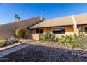 Front view of condo with landscaped yard and walkway at 8055 E Thomas Rd # D110, Scottsdale, AZ 85251