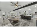 Open concept living room and kitchen with modern decor at 12524 E Saddlehorn Trl, Scottsdale, AZ 85259