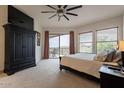 Main bedroom with large window, balcony access, and ample closet space at 14850 E Grandview Dr # 242, Fountain Hills, AZ 85268