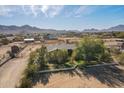 Aerial view of house, yard, and surrounding desert landscape at 19933 E San Tan Blvd, Queen Creek, AZ 85142