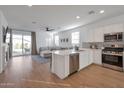 Open concept kitchen with island and stainless steel appliances at 23152 E Twilight Dr, Queen Creek, AZ 85142