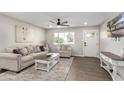 Spacious living room featuring a beige sofa and a farmhouse-style coffee table at 331 E Pierce St, Tempe, AZ 85288