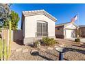 View of the home's side elevation, showcasing desert landscaping at 16217 N 182Nd Ln, Surprise, AZ 85388