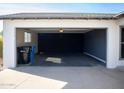 Clean and empty garage with dark gray walls at 3308 W Surrey Ave, Phoenix, AZ 85029