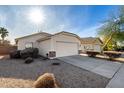 Single story house with a two-car garage and front yard at 3415 E Escuda Rd, Phoenix, AZ 85050