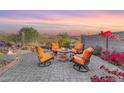 Relaxing patio with fire pit and comfortable seating at 4091 S Hackberry Trl, Gold Canyon, AZ 85118