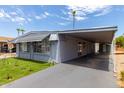 Mobile home with carport and artificial turf at 6828 W Pierce St # 126, Phoenix, AZ 85043