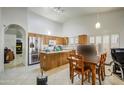 Eat-in kitchen with stainless steel appliances and island at 1676 W Harvard Ave, Gilbert, AZ 85233