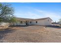 Front view of a single-story home with gravel driveway at 28919 N 153Rd Ave, Surprise, AZ 85387