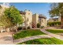 Building exterior showcasing landscaping and a walkway at 4201 E Camelback Rd # 70, Phoenix, AZ 85018