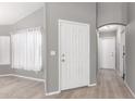 Bright entryway with white door and light gray walls at 10931 W Ruth Ave, Peoria, AZ 85345