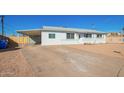 Ranch style home with carport and gravel driveway at 12820 N 29Th Dr, Phoenix, AZ 85029