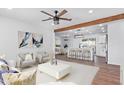 Open concept living room with kitchen view and stylish furnishings at 12820 N 29Th Dr, Phoenix, AZ 85029