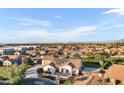 Aerial view showcasing the home's exterior and surrounding neighborhood at 21934 E Stone Crest Ct, Queen Creek, AZ 85142