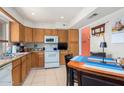 Eat-in kitchen with wood cabinets and an electric stove at 7000 N Via Camello Del Sur -- # 37, Scottsdale, AZ 85258