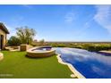 Luxury infinity pool with a spa and scenic mountain views at 10040 E Happy Valley Rd # 512, Scottsdale, AZ 85255