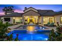 Inviting pool and spa with fire pit and outdoor seating at 11438 N 70Th St, Scottsdale, AZ 85254