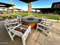 Community fire pit with seating for relaxation and gatherings at 13137 E Verbina Ln, Florence, AZ 85132