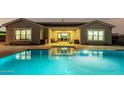 Home's backyard features a refreshing pool with patio at 18373 W Sells Dr, Goodyear, AZ 85395