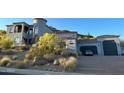 Elegant two-story home with a large driveway and beautifully landscaped grounds at 2110 E Kerry Ln, Phoenix, AZ 85024