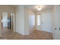 Bright entryway with tile floors and views into the kitchen and living areas at 2394 E Fiesta Dr, Casa Grande, AZ 85194