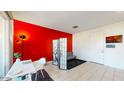Small home office with white desk and red accent wall at 4444 N 25Th St # 15, Phoenix, AZ 85016