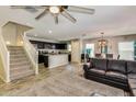 Open concept kitchen with island and stainless steel appliances at 16478 W Culver St, Goodyear, AZ 85338