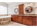 Elegant bathroom with double vanity and soaking tub at 23724 S 126Th St, Chandler, AZ 85249