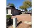 Side view of the house showing the exterior and landscaping at 7950 E Keats Ave # 194, Mesa, AZ 85209