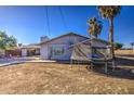 House with trampoline in front yard, single story home at 914 N 40Th Ave, Phoenix, AZ 85009