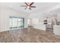 Open concept kitchen with island and stainless steel appliances at 38124 W Santa Barbara Ave, Maricopa, AZ 85138