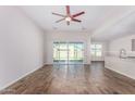 Bright living room with tile floors and sliding glass doors at 38124 W Santa Barbara Ave, Maricopa, AZ 85138