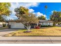 Single story home with landscaped yard and two car garage at 575 Leisure World --, Mesa, AZ 85206