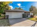 Single story home with landscaped yard and two car garage at 575 Leisure World --, Mesa, AZ 85206