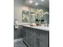 Elegant bathroom with double vanity and gray cabinets at 6480 N 82Nd St # 2203, Scottsdale, AZ 85250