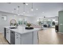 Open floor plan kitchen and living area with white kitchen island at 20865 E Timberline Rd, Queen Creek, AZ 85142
