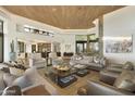 Open concept living room with high ceilings and natural light at 5630 E Rockridge Rd, Phoenix, AZ 85018