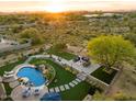 Luxury backyard oasis featuring a pool, spa, and fire pit at 6450 E Bent Tree Dr, Scottsdale, AZ 85266
