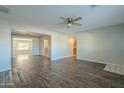 Open concept living room with hardwood floors and kitchen view at 1025 S Lola Ln, Tempe, AZ 85281