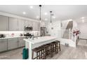 Modern kitchen with gray cabinets, quartz countertops, and an island at 1372 W Crane Dr, Chandler, AZ 85286