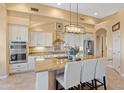 Gourmet kitchen with granite countertops and stainless steel appliances at 13931 E Peak View Rd, Scottsdale, AZ 85262