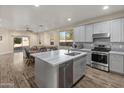 Modern kitchen with gray cabinets, island, and stainless steel appliances at 17470 N 170Th N Ln, Surprise, AZ 85374