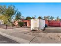 Mid-century home with a trailer in the driveway at 3044 W Desert Cove Ave, Phoenix, AZ 85029