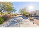 Long driveway leading to a desert home at 34830 N Desert Winds Cir, Carefree, AZ 85377