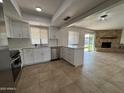 Open concept kitchen with island and view into living room at 4643 W Laurel Ln, Glendale, AZ 85304