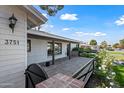 White brick home with a modern front porch and walkway at 3751 E Fairmount Ave, Phoenix, AZ 85018