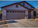 House exterior featuring a two-car garage and landscaping at 881 E Appaloosa Rd, Gilbert, AZ 85296