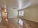 Bright and spacious living room with tiled floors and large windows at 881 E Appaloosa Rd, Gilbert, AZ 85296