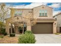 Two-story house with a large brown garage door and landscaping at 9567 W Robin Ln, Peoria, AZ 85383