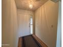 Bright and airy entryway with wood flooring and light walls at 1131 S St Paul --, Mesa, AZ 85206